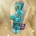 Turquoise satin statement tie with jeweled butterfly centerpiece, shown with matching earrings and bracelet — Re Tied by M.W. Designs